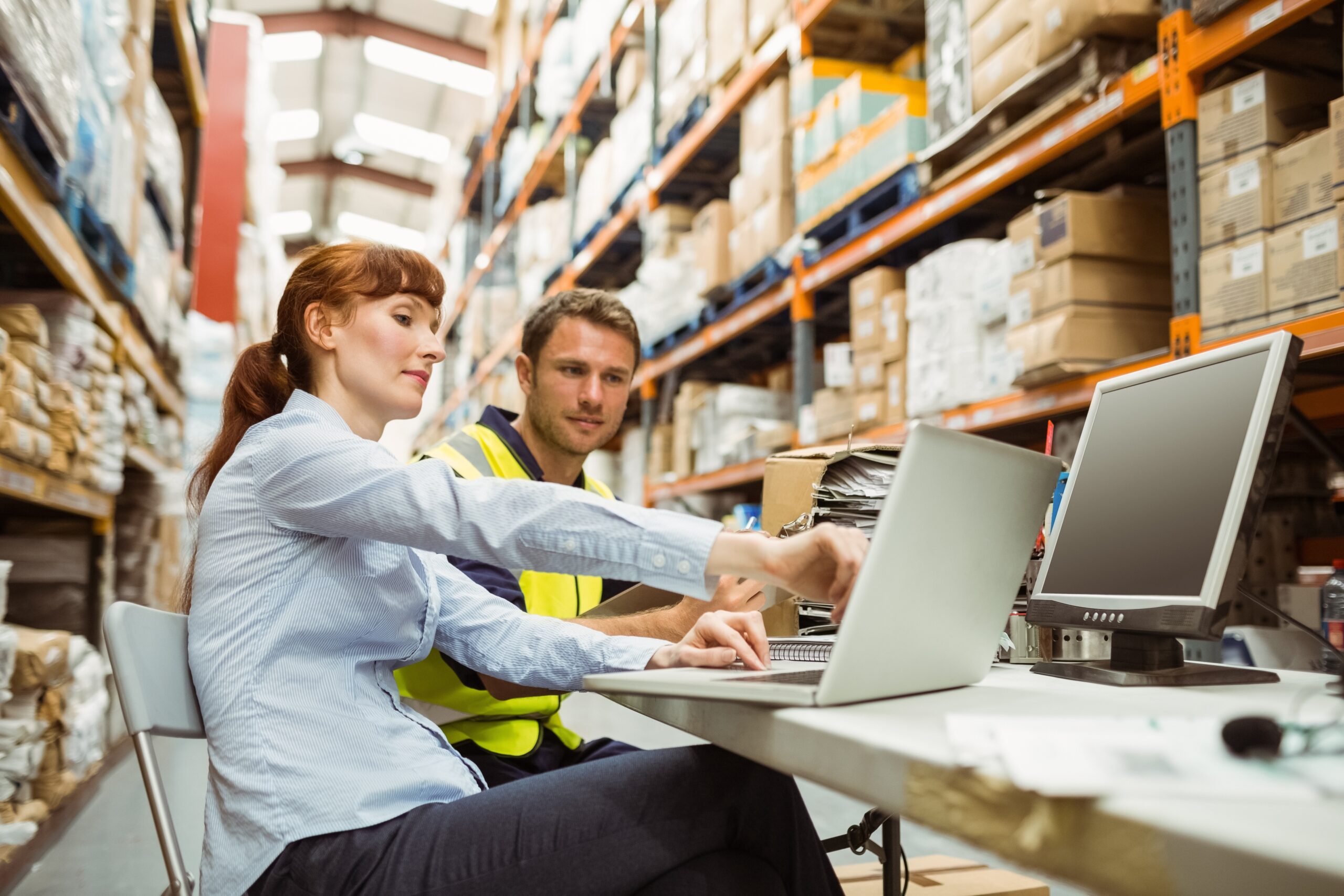 Staff using Lazr to generate a parcel shipping quote on a laptop.